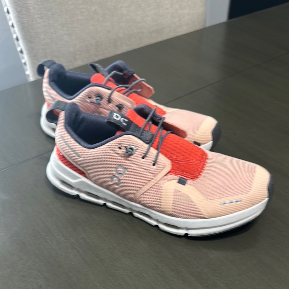 On Running Pink and Red Sneakers with Streamlined Design